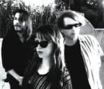 A monochrome picture of a cluster of individuals donning sunglasses, with hints of magic wands.