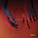 Two hands, awash in a blend of blue and red lighting, rise against a backdrop embossed with the number 9 and "Count To Nine." In the bottom right corner, "Cathedral in Flames" heralds an electrifying release.