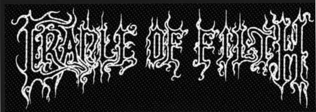 The image shows the words “Cradle of Filth” written in a white, stylised, ornate font on a black background.